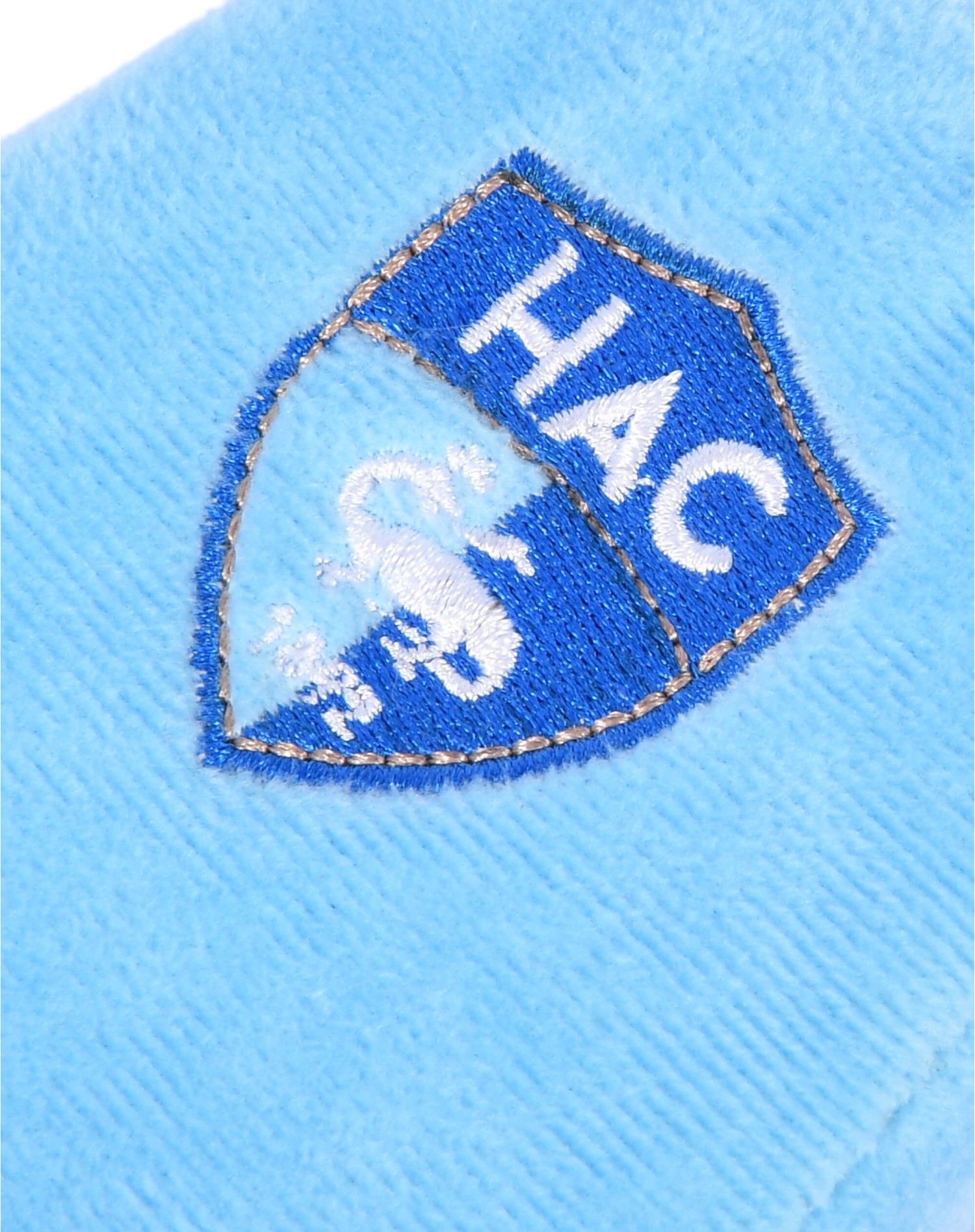 Chaussons Saly - gros plan logo Chaussons Saly - gros plan logo